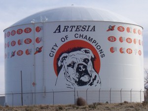 Water Tank with Picture of Bulldog and Words Reading, "Artesia, City of Champions"